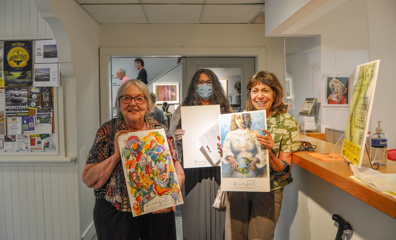 I ran into artists Nancy Wells, left, and Erica Hart at the Delaware Valley Arts Alliance in Narrowsburg, NY a few days ago, where they were dropping off their finished designs for Sunday’s Riverfest poster auction. As evidenced here, Tamara D’Agostino, center, still has a little way to go on hers.